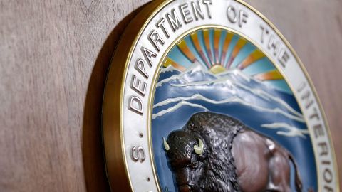 The seal of U.S. Interior Department is seen during a news conference May 11, 2010 in Washington, DC.  Secretary of Interior Ken Salazar announced that he would split the Minerals Management Service into two agencies, one would in charge the inspection of oil rigs, investigation of oil companies, and enforcement of safety regulations, as the other would supervise drilling leases and royalty dollar collections.  (Alex Wong/Getty Images)