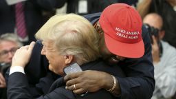 WASHINGTON, DC - OCTOBER 11:  (AFP OUT) (EDITORS NOTE: Retransmission with alternate crop.) U.S. President Donald Trump hugs rapper Kanye West during a meeting in the Oval office of the White House on October 11, 2018 in Washington, DC. (Photo by Oliver Contreras - Pool/Getty Images)