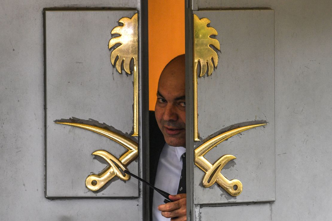 A security officer peers through a partially open door at the Saudi consulate in Istanbul on Friday.