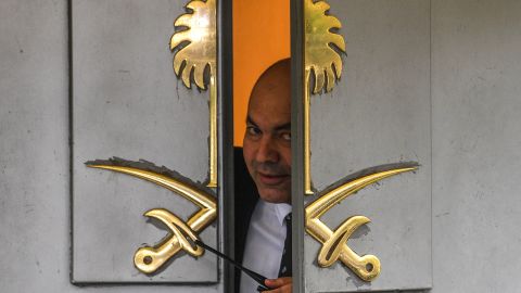A security officer peers through a partially open door at the Saudi consulate in Istanbul on Friday.
