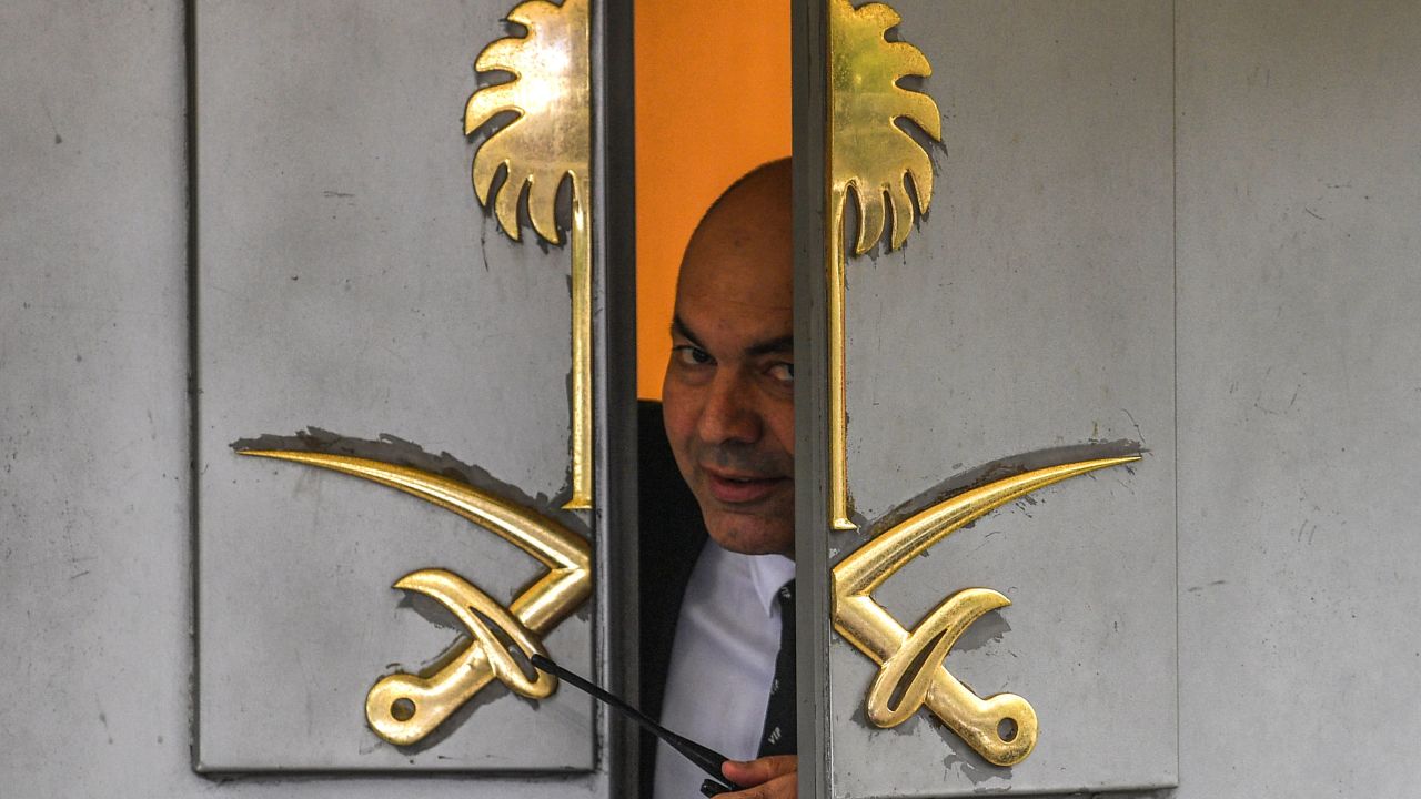 A security officer peers through a partially open door at the Saudi consulate in Istanbul on Friday.