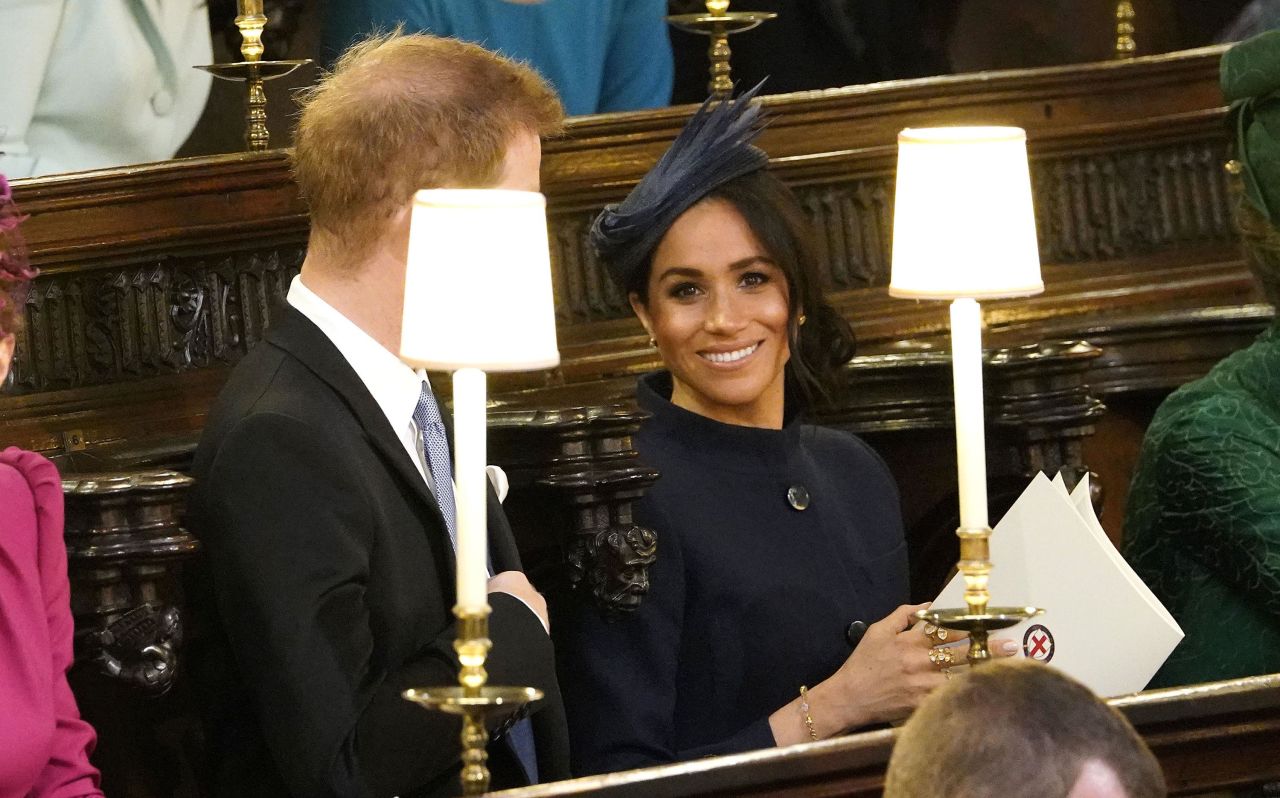 Prince Harry and Meghan, the Duke and Duchess of Sussex, wait for the ceremony to begin.