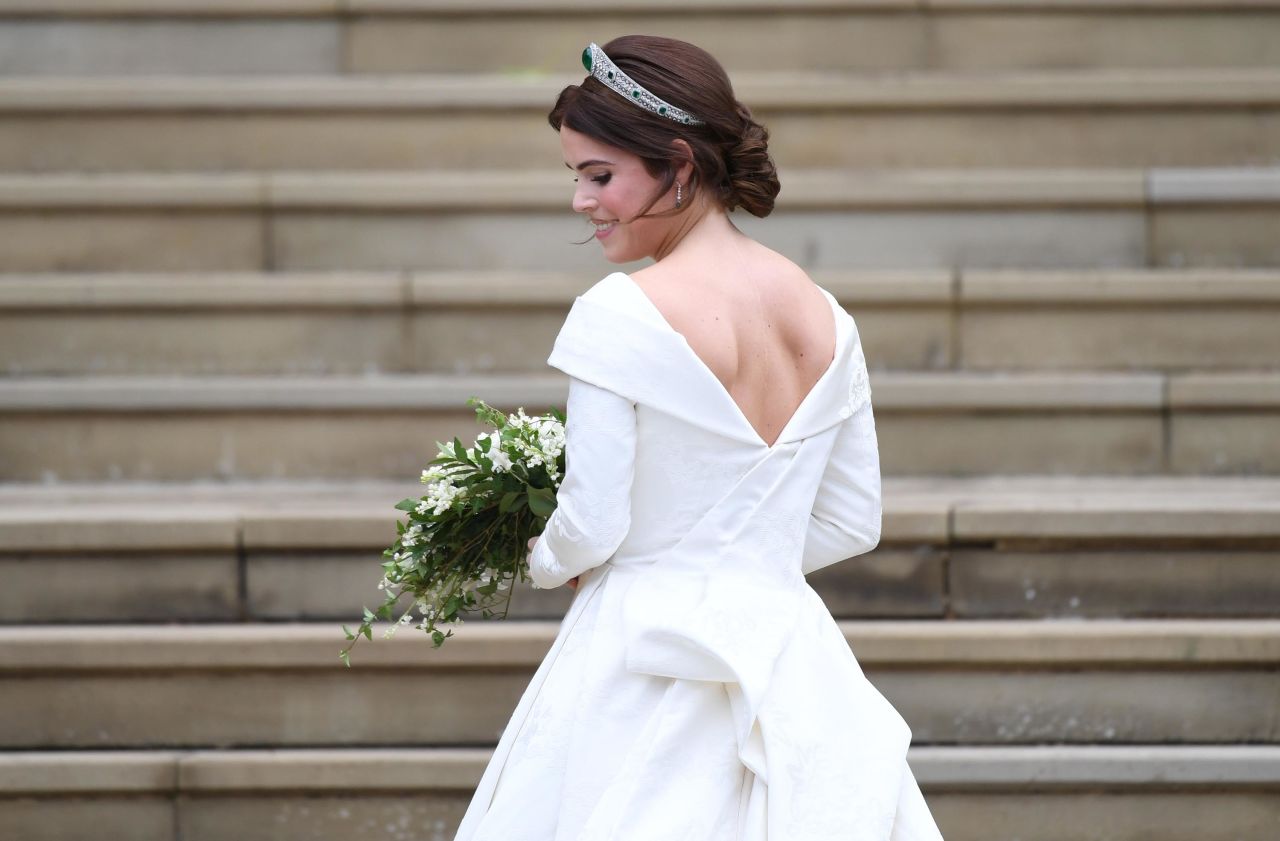 The back of Princess Eugenie's wedding gown was the central talking point as she made her first appearance.