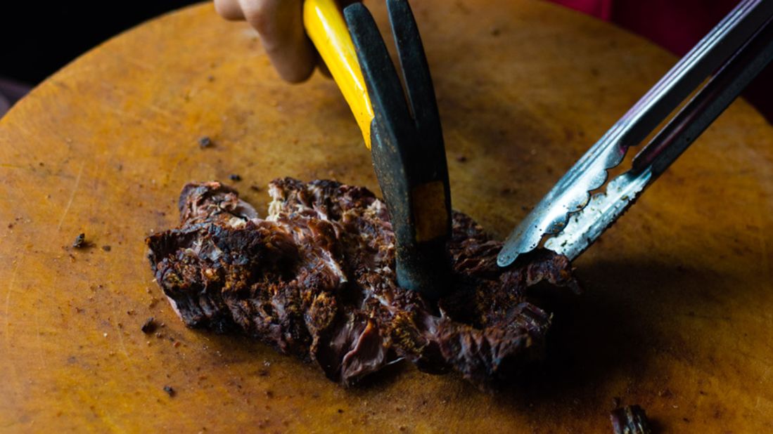 <strong>Jin tup: </strong>"Pounded beef" is a stringy cut of beef marinated in fish sauce and salt, grilled over coal, and hammered.