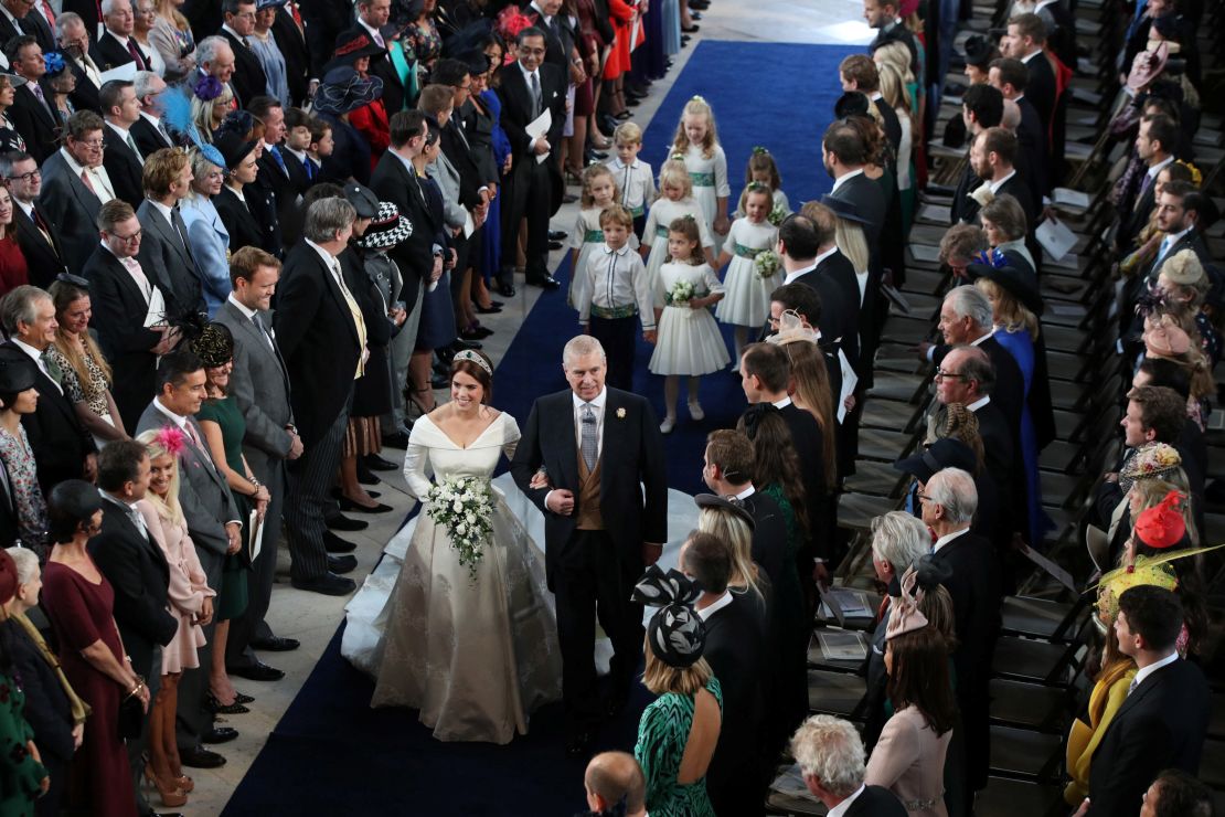 Princess Eugenie walks down the aisle with her father, the Duke of York.