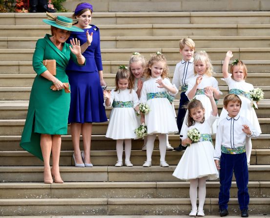 Sarah Ferguson, Princess Beatrice and the bridesmaids and page boys, including Prince George and Princess Charlotte, wave as the bride and groom depart from the chapel.