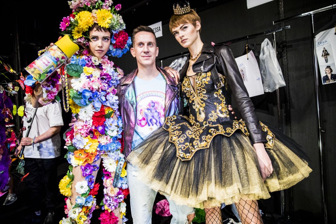 Jeremy Scott and models backstage ahead of a Moschino show in 2017 in Milan.