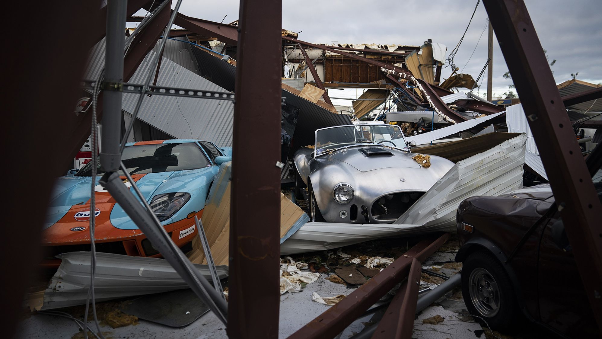 Collector cars are covered in debris in Panama City on October 11.