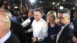 Pastor Andrew Brunson, center, and his wife Norine Brunson arrive at Adnan Menderes airport for a flight to Germany after his release following his trial in Izmir, Turkey, Friday, Oct. 12, 2018, A Turkish court on Friday convicted an American pastor of terror charges but released him from house arrest and allowed him to leave Turkey, in a move that is likely to ease tensions between Turkey and the United. (AP Photo/Emre Tazegul)