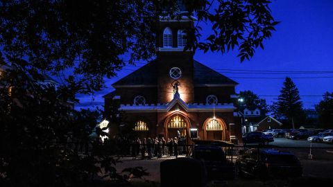 Mourners line up outside St. Stanislaus Roman Catholic Church in Amsterdam, New York, to pay their respects to victims of last weekend's fatal limo crash.