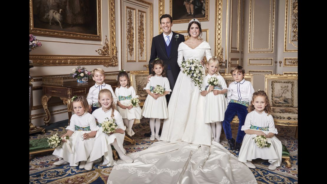 Prince George smiles for the camera, at left, sitting next to his sister, Princess Charlotte.