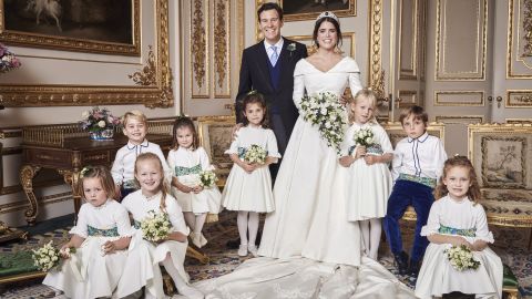 Prince George smiles for the camera, at left, sitting next to his sister, Princess Charlotte.