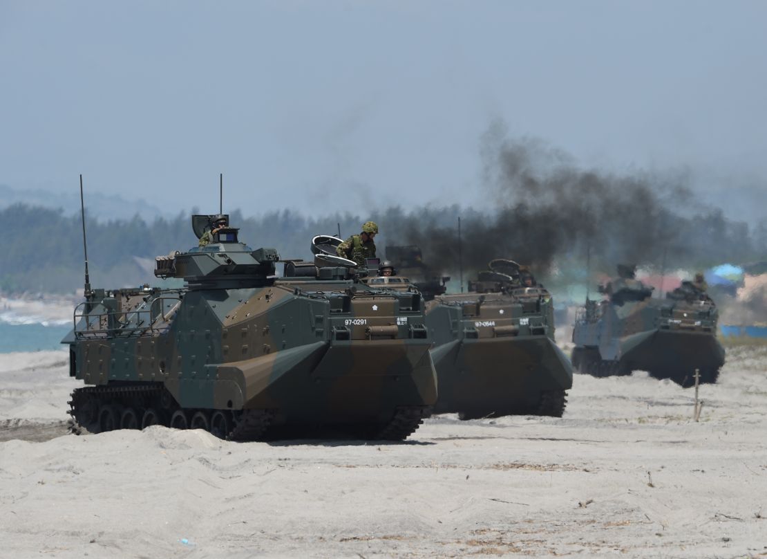 Japanese Ground Self Defense Forces' amphibious assault vehicles hit the beach during an amphibious landing exercise in the Philippines in 2018.