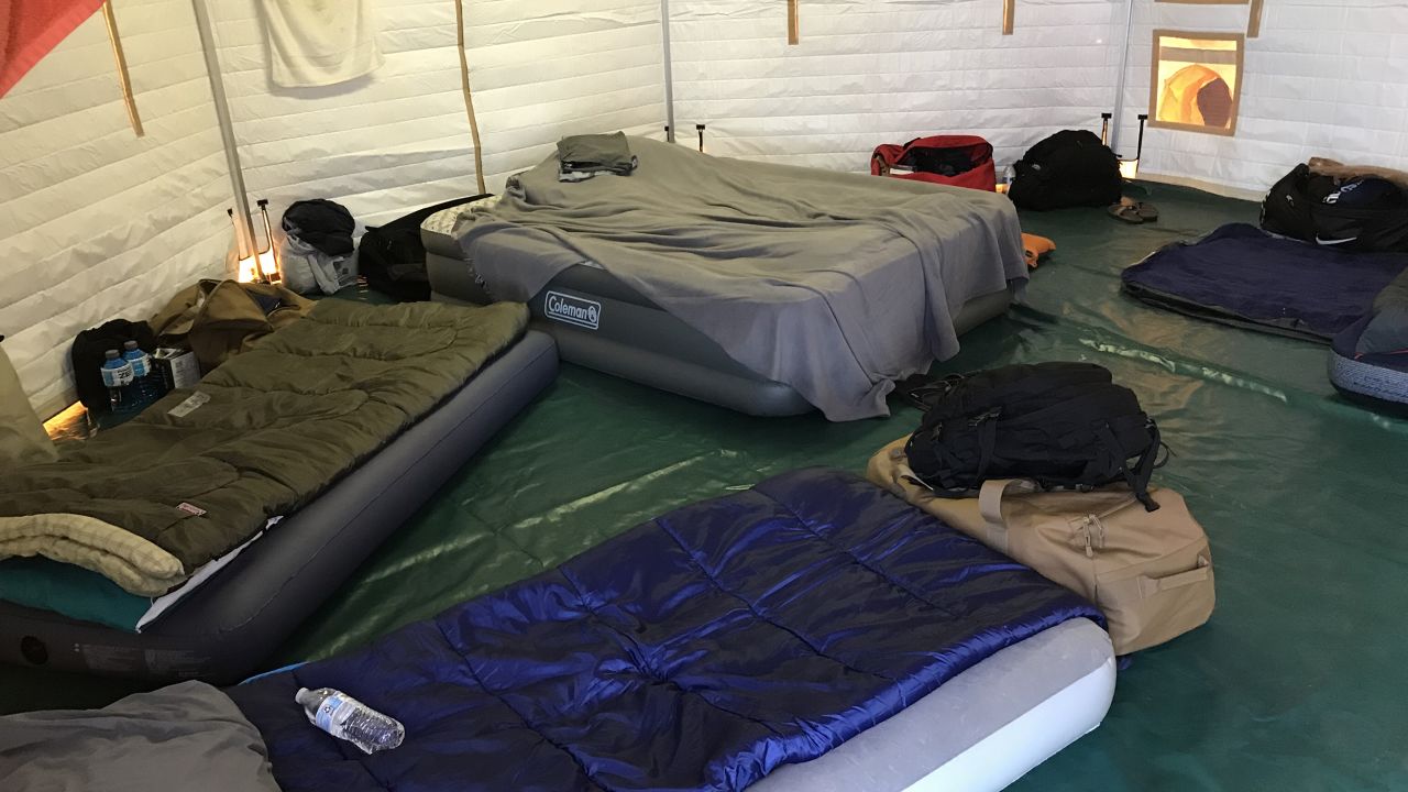 The interior of a sleeping tent for firefighters at their base camp in a Panama City mall.