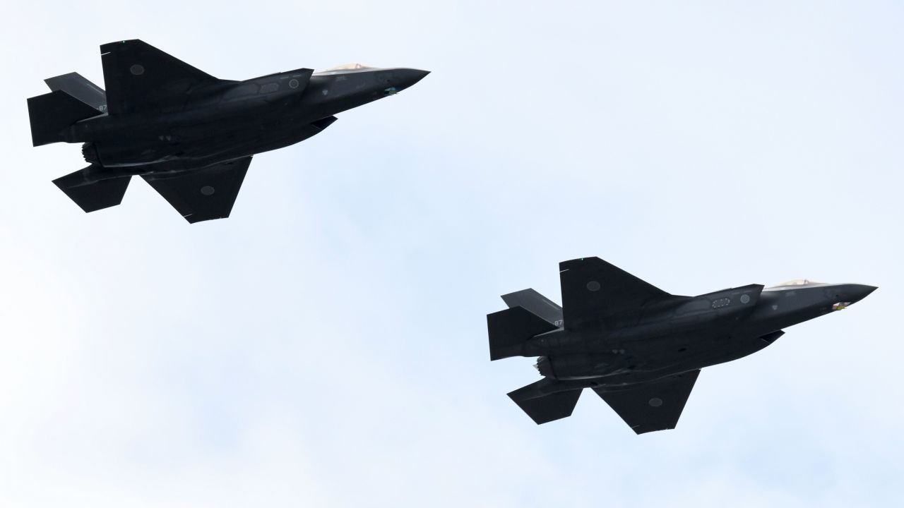 F-35 fighter aircraft from the Japan Air Self-Defense Force take part in a military review in 2018.