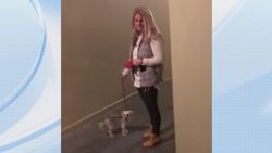 woman blocks man from entering apartment 2