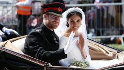 WINDSOR, ENGLAND - MAY 19: (EDITORS NOTE: Retransmission of #960087582 with alternate crop.) Prince Harry, Duke of Sussex and Meghan, Duchess of Sussex wave from the Ascot Landau Carriage during their carriage procession on Castle Hill outside Windsor Castle in Windsor, on May 19, 2018 after their wedding ceremony.  (Photo by Aaron Chown/WPA Pool/Getty Images)