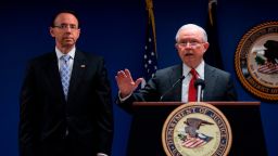 US Attorney General Jeff Sessions (R) and US Deputy Attorney General Rod Rosenstein make an announcement on efforts to reduce transitional crime during a press conference at the US Attorney's Office in Washington, DC, on October 15, 2018. (JIM WATSON/AFP/Getty Images)