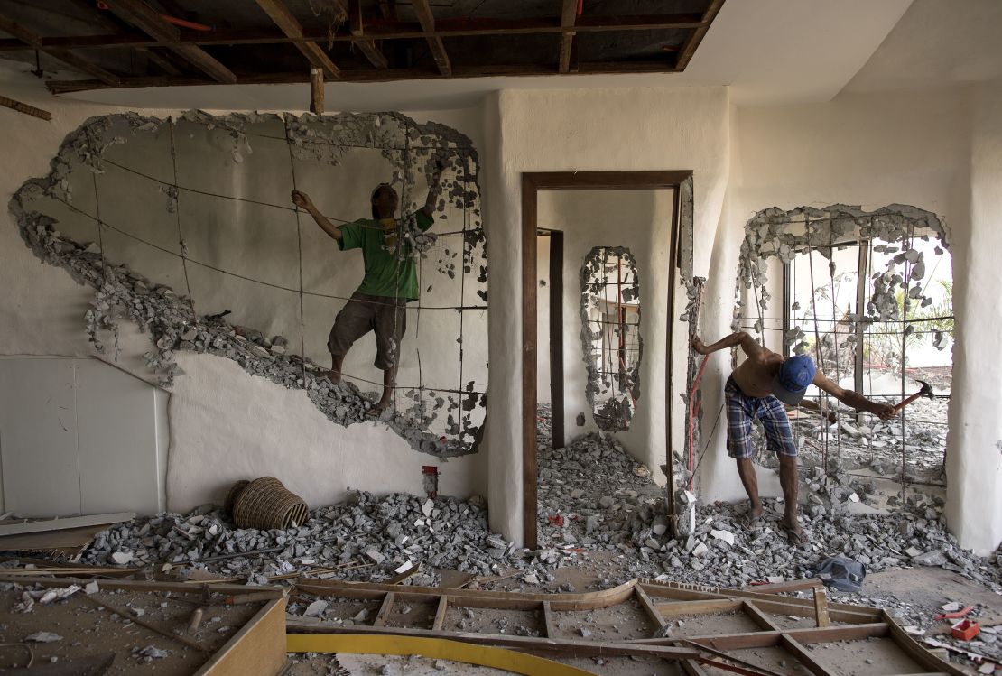 Workers demolish the walls of the West Cove Hotel on Boracay in April 2018. 