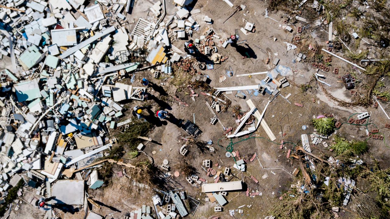 Down amid the rubble, searchers comb through a flattened home in Mexico Beach on Friday, October 12. 