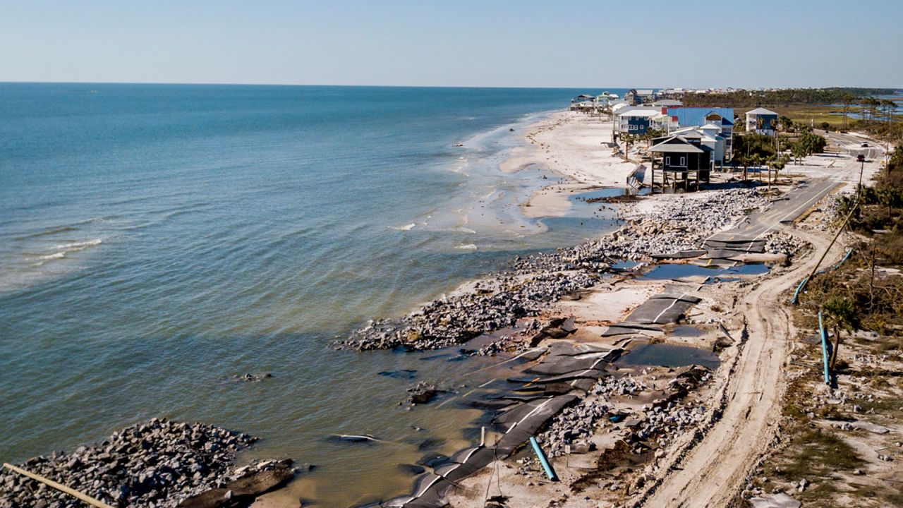 The road that leads into Cape San Blas, Florida, lays broken in the sun on Saturday, October 13, three days after Hurricane Michael roared ashore.