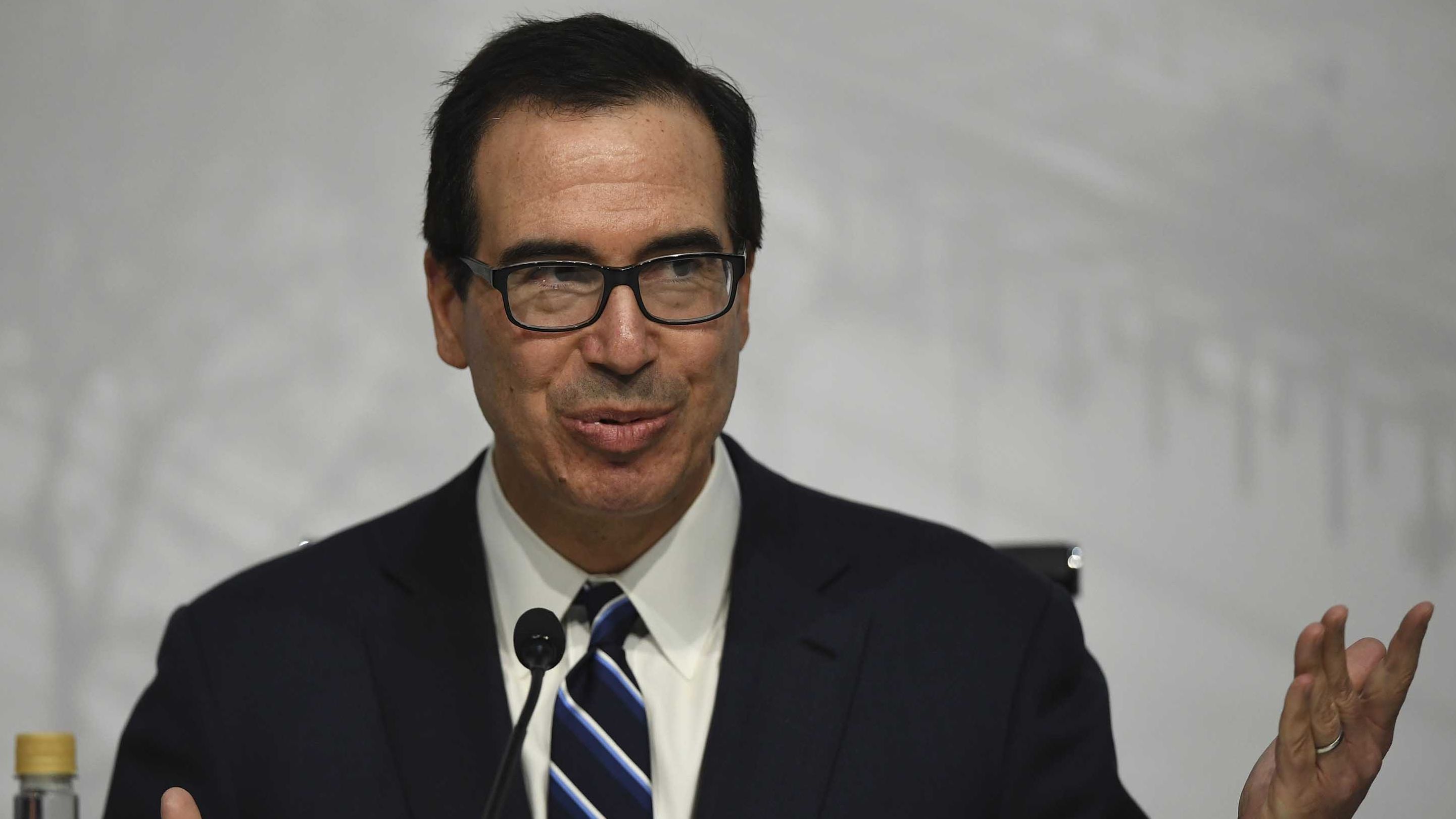 US Secretary of the Treasury Steven Mnuchin, gestures during a press conference in Buenos Aires, on July 22, 2018, at the end of the G20 Finance Ministers and Central Bank Governors meeting. - Group of 20 finance ministers warned on Sunday that "heightened trade and geopolitical tensions" posed risks to global economic growth as two days of meetings came to a close. (Photo by EITAN ABRAMOVICH / AFP)        (Photo credit should read EITAN ABRAMOVICH/AFP/Getty Images)