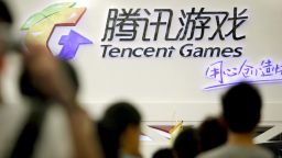 Visitors walk past a Tencent Holdings Ltd. game booth at the ChinaJoy Expo, also known as the China Digital Entertainment Expo and Conference, in Shanghai, China, on Friday, July 29, 2011. The global cloud-computing market is expected to increase to $241 billion in 2020 from $40.7 billion in 2011, according to Forrester Research Inc. Photographer: Qilai Shen/Bloomberg via Getty Images