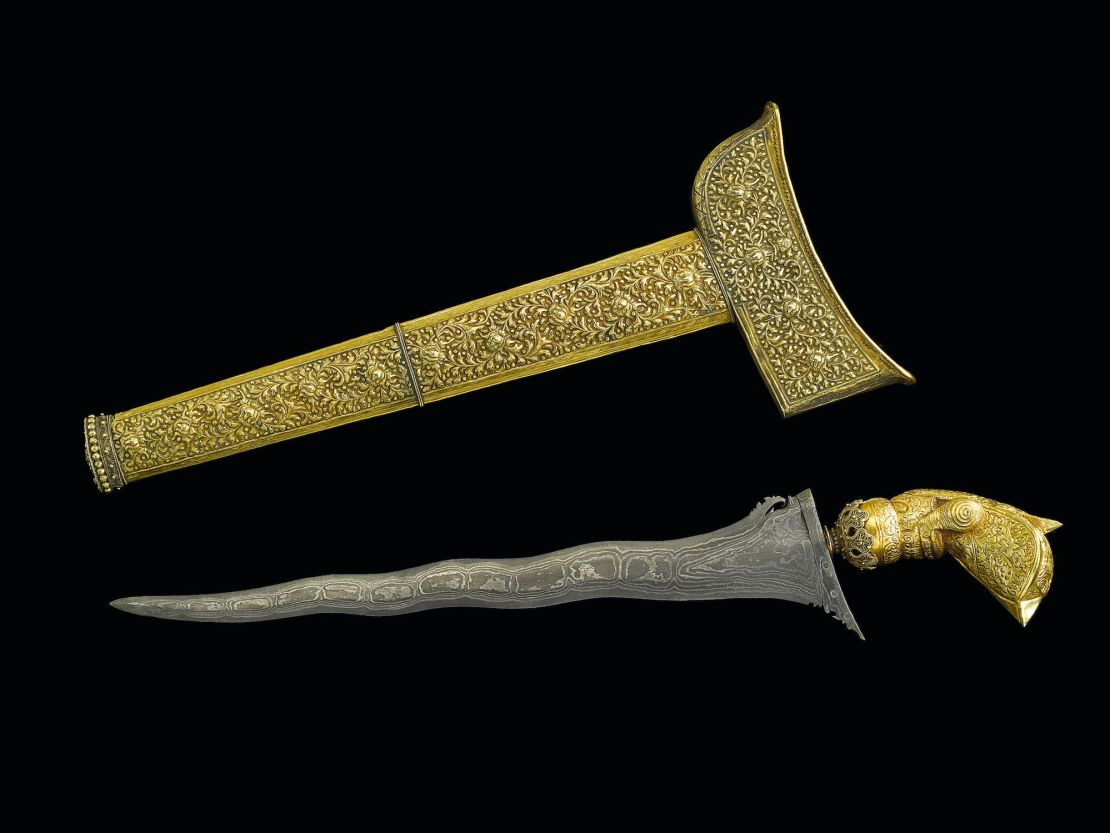 A 19th-century gold mounted dagger and scabbard from present-day Malaysia.