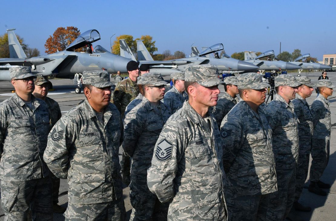 US servicemen stand in front of F-15 fighter jets during air force exercises at Starokostiantyniv Air Base.