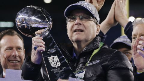 Team owner Paul Allen of the Seattle Seahawks celebrates with the Vince Lombardi trophy after defeating the Denver Broncos 43-8 in Super Bowl XLVIII at MetLife Stadium on February 2, 2014, in East Rutherford, New Jersey. 