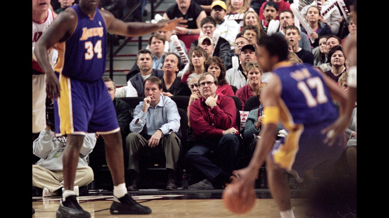 Allen sits courtside with Portland Trail Blazers President Bob Whitsitt, left, during the Round One Playoff Game 3 against the Los Angeles Lakers at the Rose Garden in Portland, Oregon in 2001. Allen bought two professional sports teams -- the NBA's Trail Blazers and the NFL's Seattle Seahawks -- and was involved with both until his death. 