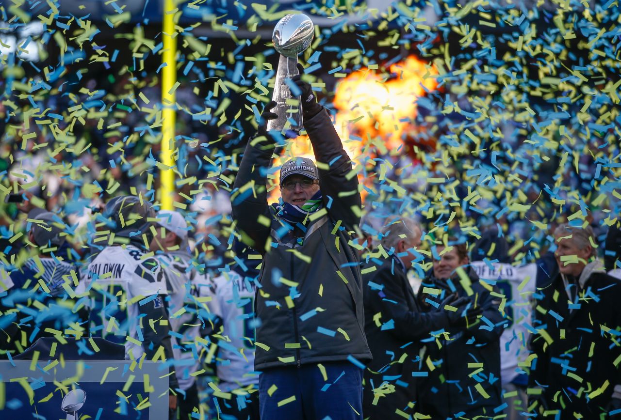 Team Owner Paul Allen of the Seattle Seahawks holds the Lombardi Trophy during ceremonies following the Super Bowl XLVIII Victory Parade at Century Link Field on February 5, 2014, in Seattle, Washington.