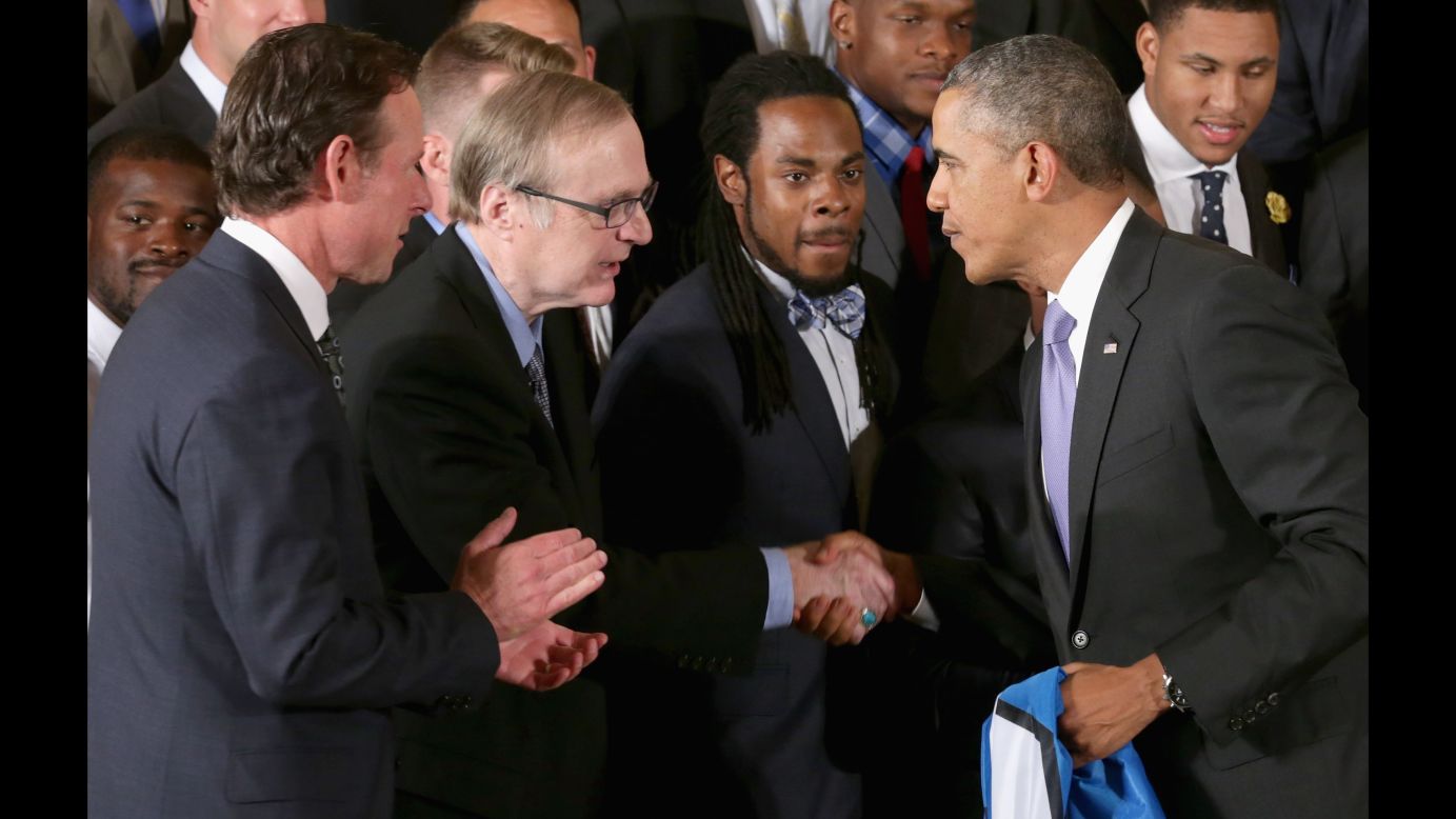 President Barack Obama congratulates Seattle Seahawks owner Paul Allen during a ceremony honoring the players, coaches and executives of the Super Bowl XLVIII champions in the East Room of the White House May 21, 2014 in Washington, DC.