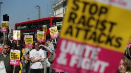 Demonstrators gather with placards during a protest called by the 'Stand Up To Racism' group in Croydon, south London, on April 8, 2017 following the suspected hate crime attack on  a 17-year-old Kurdish Iranian asylum-seeker.
The teenager was badly beaten by a group of around 20 people while he was at a bus stop with two friends outside a pub in Croydon on March 31.  / AFP PHOTO / Daniel LEAL-OLIVAS        (Photo credit should read DANIEL LEAL-OLIVAS/AFP/Getty Images)