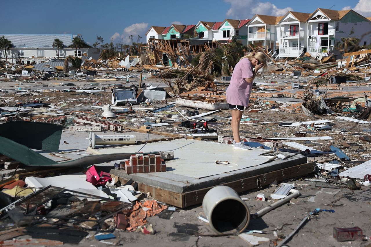 Lisa Patrick is overcome with emotion as she visits the remains of her home in Mexico Beach, Florida, on Monday, October 15.