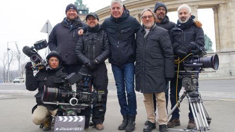 Anthony Bourdain posing with the Budapest crew for a group picture.