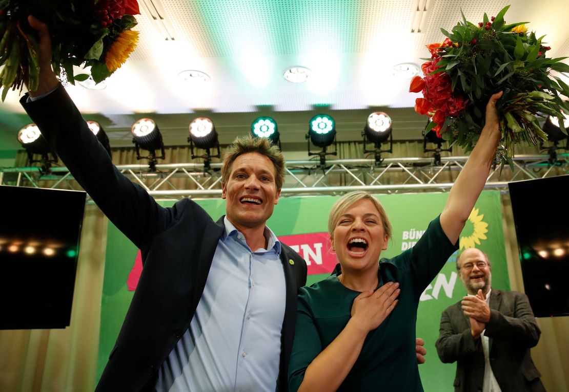 Katharina Schulze and Ludwig Hartmann, co-leaders of the Green Party in Bavaria, celebrate the results Sunday evening.