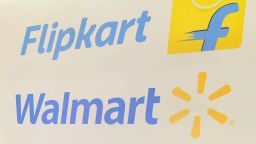 This photo taken on May 9, 2018 shows the Walmart and Flipkart logos at an event in Bangalore, as a deal was announced for Walmart to buy a stake in Flipkart. - US retail behemoth Walmart will buy a 77 percent stake in Indian e-commerce giant Flipkart for $16 billion, Walmart said in a statement May 9. (Photo by - / AFP)        (Photo credit should read -/AFP/Getty Images)