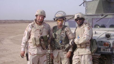 Command Sgt. Maj. Sam Rhodes, left, during one of his tours overseas.