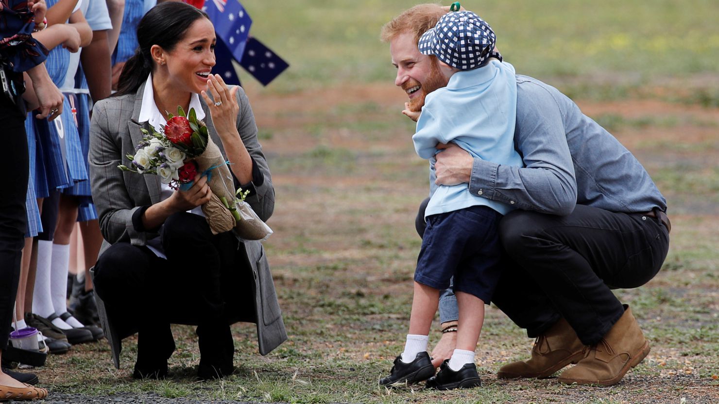 Prince Harry and Meghan get a hug from 5-year-old Luke Vincent at Dubbo Airport after arriving in the rural New South Wales town. 