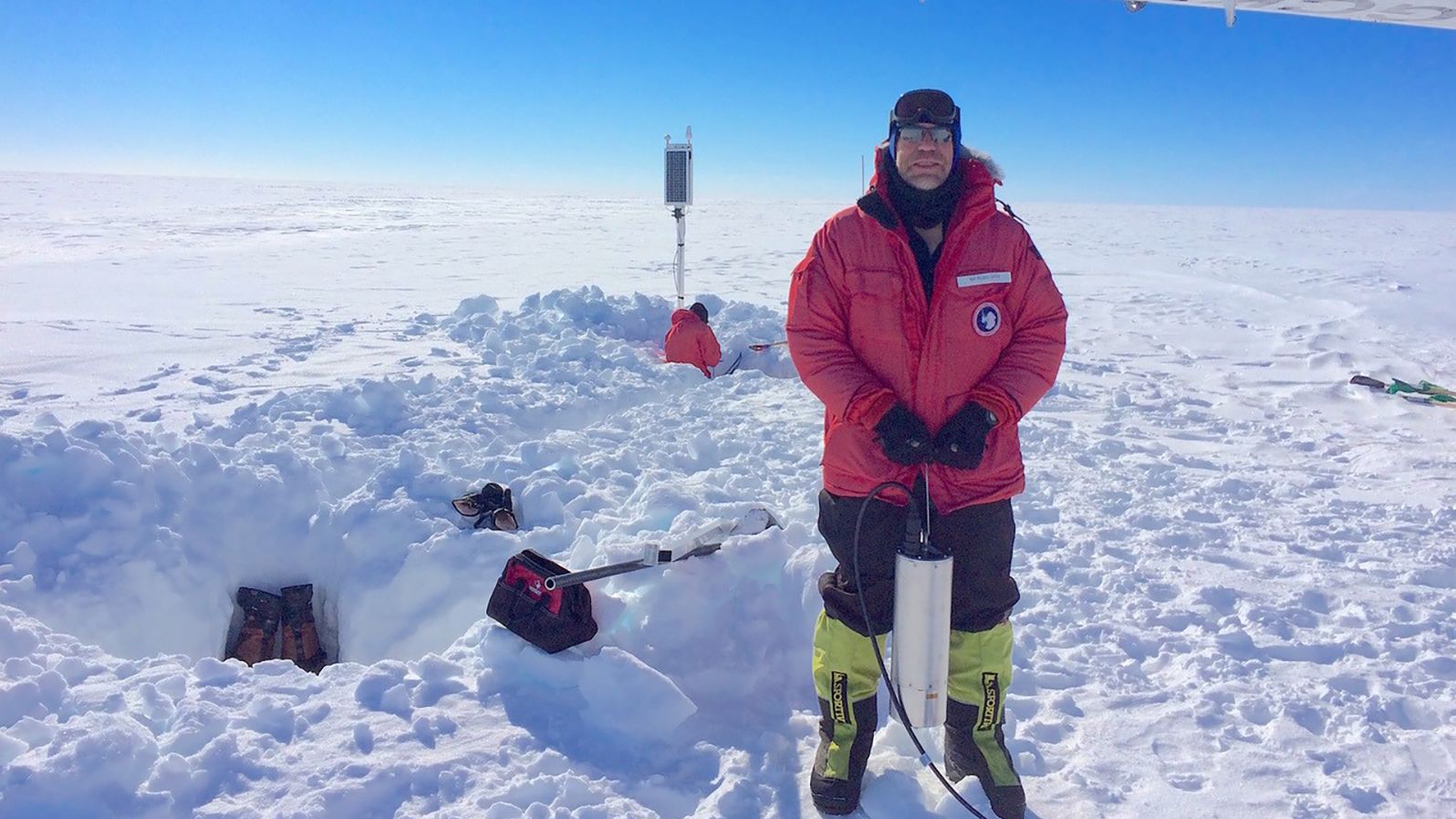 Researcher Rick Aster installs a broadband seismometer in Antarctica's Ross Ice Shelf.