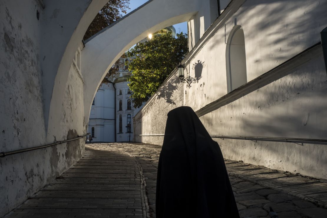 A monk walks to the Evening Divine Office service at the Refectory Church of Sts. Anthony and Theodosius at the Kyiv-Pechersk Lavra in Kiev, Ukraine.