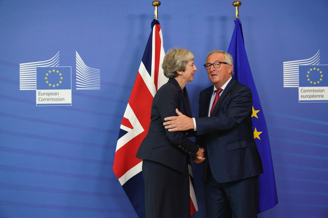 European Commission President Jean-Claude Juncker shakes hands with British Prime Minister Theresa May.