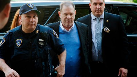 NYPD Detective Nicholas DiGaudio, right, escorts Harvey Weinstein into court in May 2018.