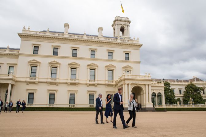 Governor of Victoria Linda Dessau and her husband, Anthony Howard, walk with Harry and Meghan at a reception at Government House in Melbourne. 