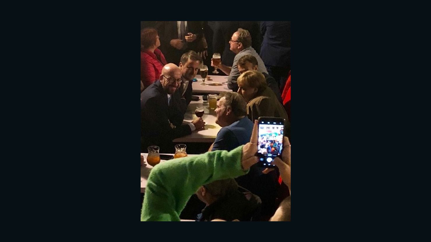 From left to right, Belgian Prime Minister Charles Michel, Luxembourg PM Xavier Bettel, French President Emmanuel Macron and German Chancellor Angela Merkel enjoy a beer in Brussels on October 17.