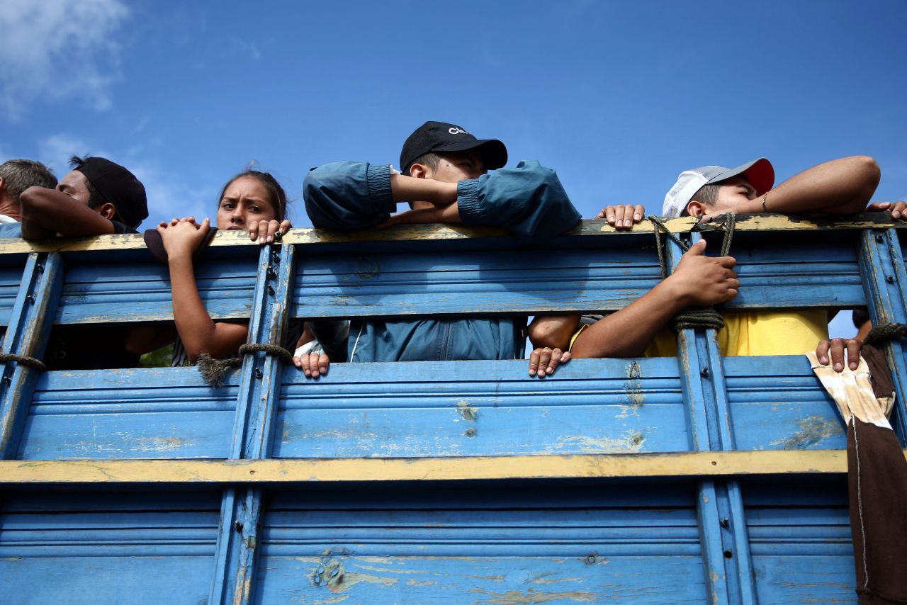 Honduran migrants in the caravan are pictured inside a truck on Thursday. 