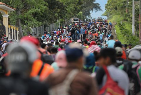 The caravan moves north after crossing the border from Honduras into Guatemala on Monday.