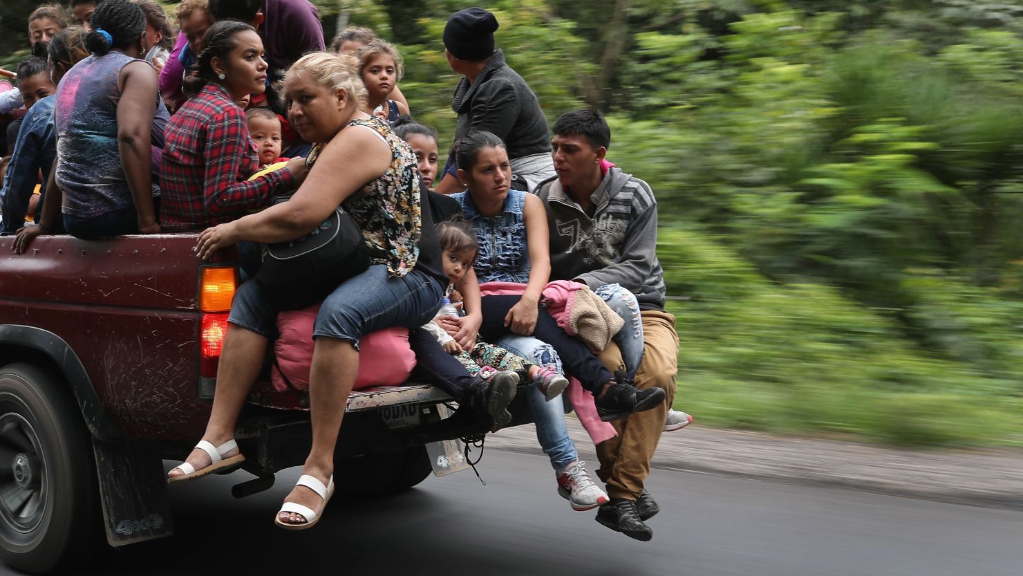 Honduran immigrants, some of more than 1,500 people traveling in a migrant caravan, move north on October 16, 2018 near Quezaltepeque, Guatemala. 
