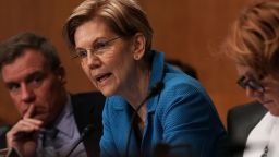 WASHINGTON, DC - JULY 19:  U.S. Sen. Elizabeth Warren (D-MA) (2nd L) speaks as Sen. Mark Warner (D-VA) (L) listens during a confirmation hearing before the Senate Committee on Banking, Housing, and Urban Affairs July 19, 2018 on Capitol Hill in Washington, DC. Reed will become the president of the Export-Import Bank of the United States if confirmed by the Senate.  (Photo by Alex Wong/Getty Images)